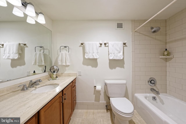 full bath featuring toilet, vanity, tub / shower combination, and baseboards