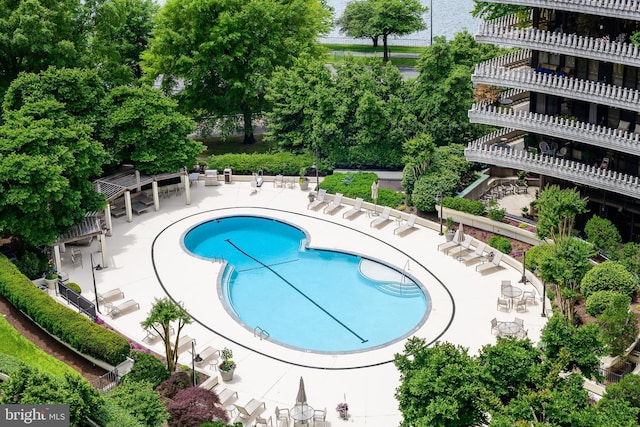 community pool with a patio area