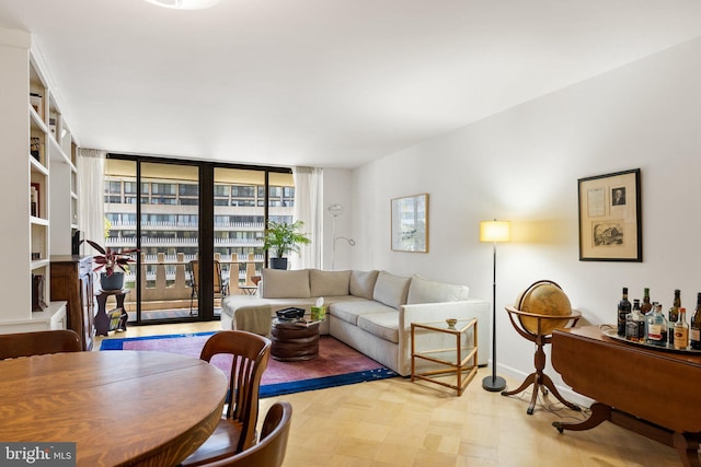living room with tile patterned floors and baseboards