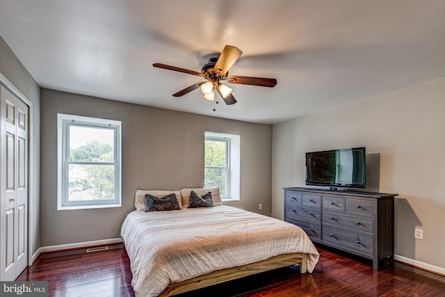 bedroom featuring dark wood-style floors, baseboards, and ceiling fan