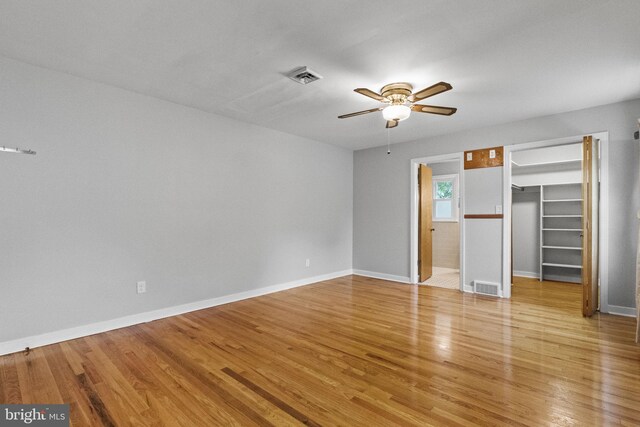 15 Renee, Lawrence Township, NJ 08648 - unfurnished bedroom featuring light wood-style flooring, baseboards, a walk in closet, and a ceiling fan