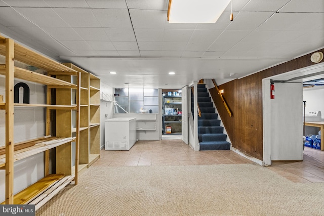 15 Renee, Lawrence Township, NJ 08648 - finished basement featuring tile patterned flooring, carpet floors, stairway, a drop ceiling, and wooden walls
