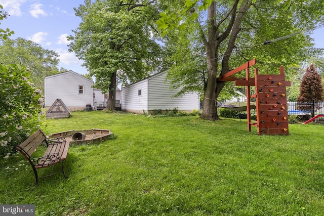 15 Renee, Lawrence Township, NJ 08648 - view of grassy yard with an outdoor fire pit