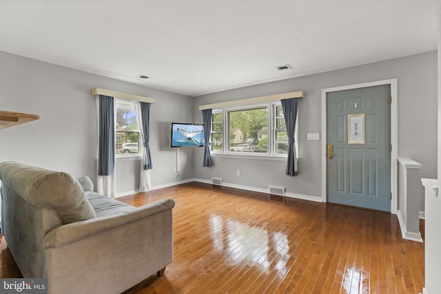 15 Renee, Lawrence Township, NJ 08648 - living area with plenty of natural light, wood-type flooring, and baseboards