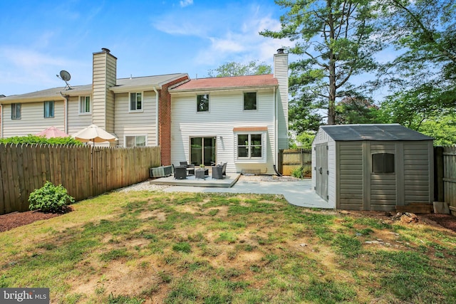 18165 Metz Dr, Germantown, MD 20874 - back of property featuring a patio area, a chimney, and an outdoor living space