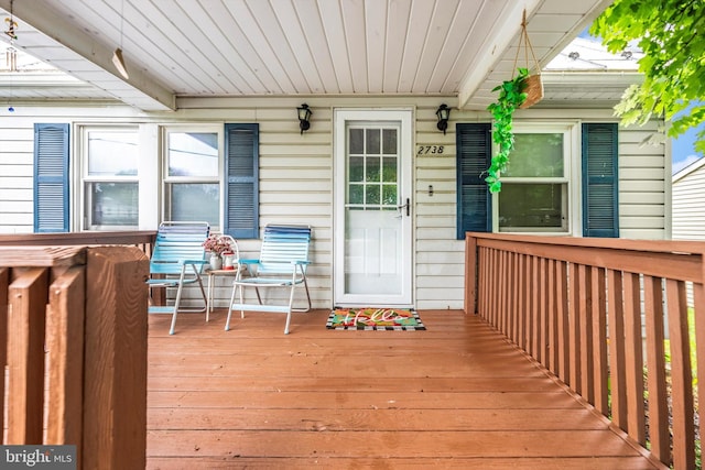 wooden deck featuring covered porch