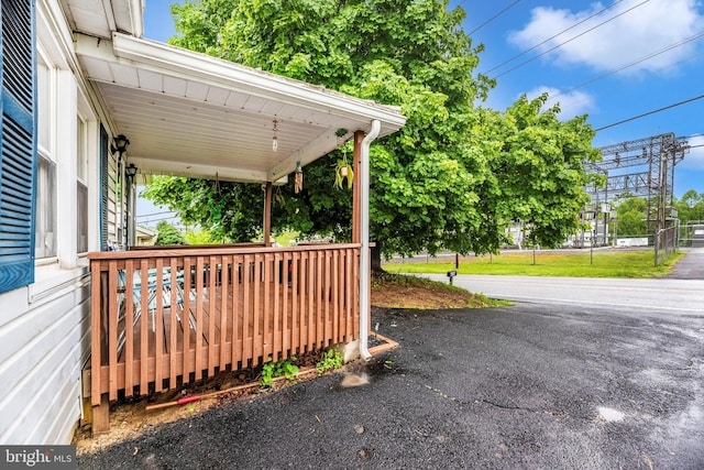 view of yard featuring covered porch