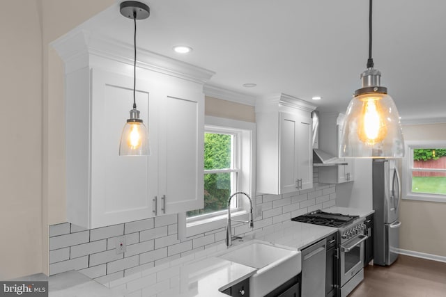 669 Worthington Dr, Warminster, PA 18974 - kitchen featuring stainless steel appliances, a sink, white cabinets, tasteful backsplash, and wall chimney exhaust hood