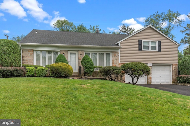 669 Worthington Dr, Warminster, PA 18974 - view of front of home with driveway, a front yard, an attached garage, and a shingled roof