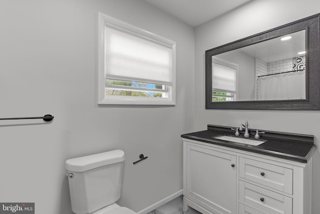 669 Worthington Dr, Warminster, PA 18974 - bathroom with marble look tile flooring, vanity, plenty of natural light, and toilet