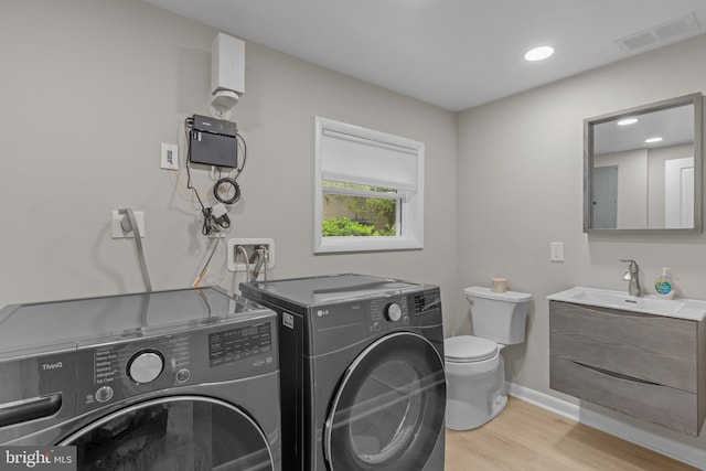 669 Worthington Dr, Warminster, PA 18974 - washroom featuring independent washer and dryer, light wood-type flooring, and baseboards