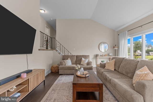 669 Worthington Dr, Warminster, PA 18974 - living room with vaulted ceiling, wood finished floors, baseboards, and stairway