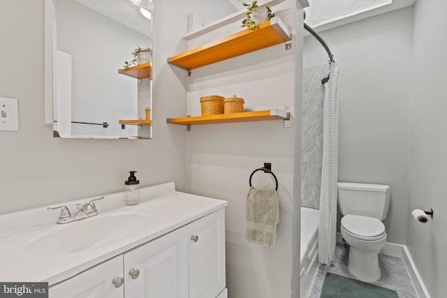 bathroom featuring toilet, vanity, baseboards, and shower / tub combo