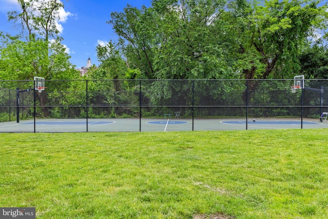 view of tennis court featuring community basketball court