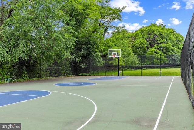 view of sport court featuring community basketball court and fence