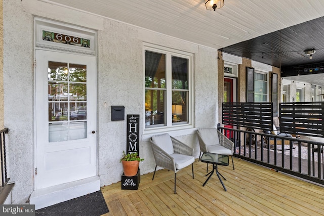 wooden deck featuring covered porch