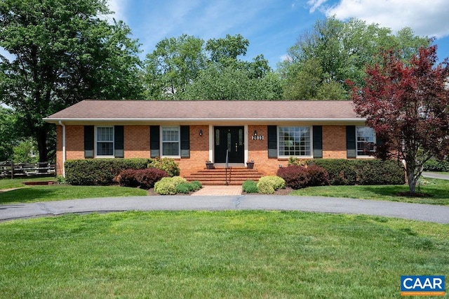 single story home with brick siding, a front lawn, and entry steps