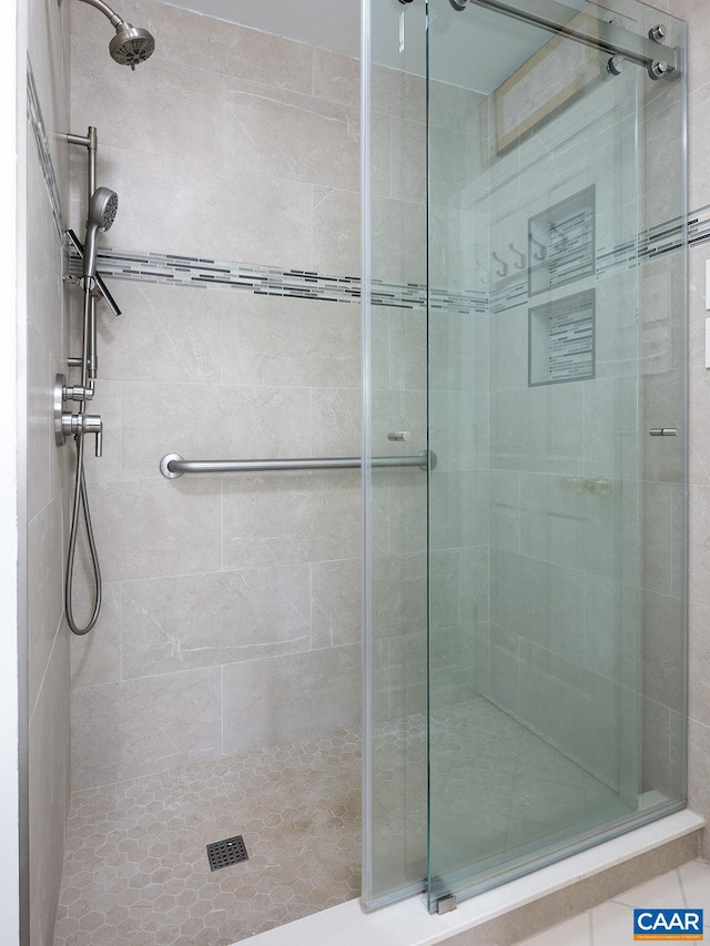 bathroom with a shower stall