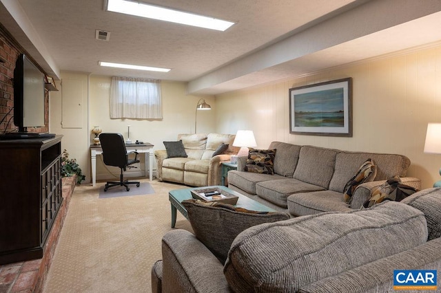 living area with a desk and light carpet