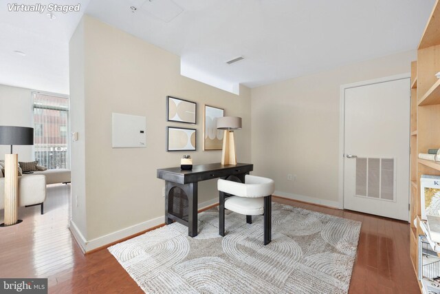 office space featuring wood finished floors and baseboards