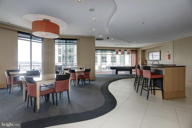 dining room featuring light tile patterned floors and recessed lighting