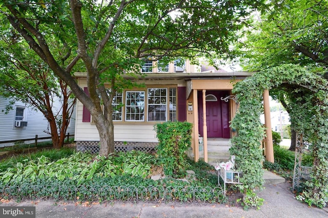 view of front of house featuring cooling unit