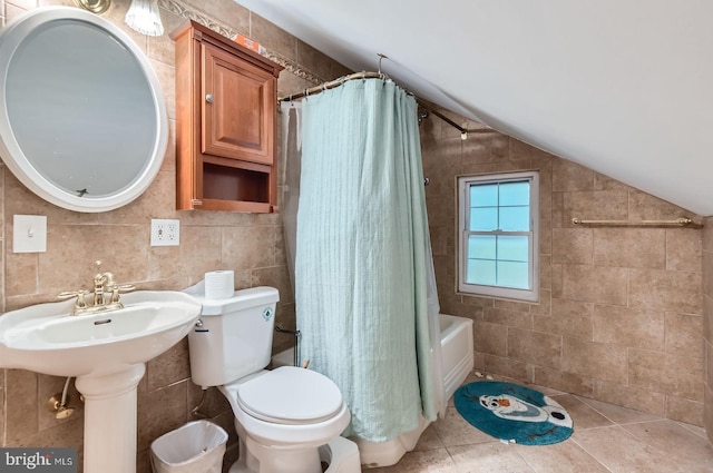 5622 Pilgrim Rd, Baltimore, MD 21214 - full bath with lofted ceiling, tile walls, shower / bath combo with shower curtain, and tile patterned floors