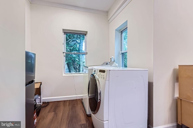 5622 Pilgrim Rd, Baltimore, MD 21214 - laundry room with wood finished floors and washing machine and clothes dryer