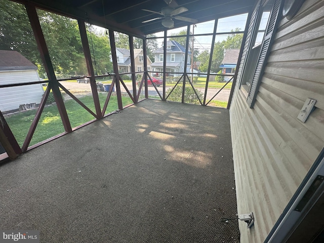 5622 Pilgrim Rd, Baltimore, MD 21214 - unfurnished sunroom with ceiling fan and a residential view