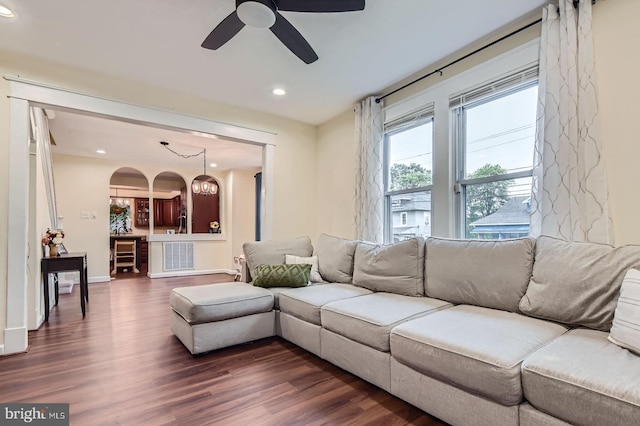 5622 Pilgrim Rd, Baltimore, MD 21214 - living area featuring dark wood-style flooring, recessed lighting, a ceiling fan, and arched walkways