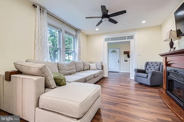 5622 Pilgrim Rd, Baltimore, MD 21214 - living room with dark wood-style floors, a glass covered fireplace, ceiling fan, and recessed lighting
