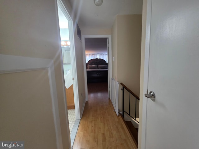 hall with light wood-style floors