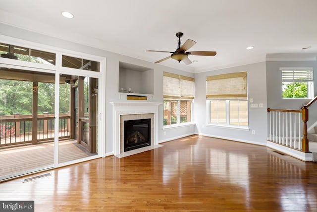 23462 Twin Falls Ter, Ashburn, VA 20148 - unfurnished living room featuring wood finished floors, ornamental molding, a ceiling fan, a fireplace with flush hearth, and recessed lighting