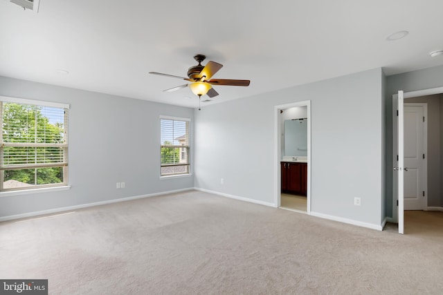 23462 Twin Falls Ter, Ashburn, VA 20148 - unfurnished bedroom featuring light carpet, baseboards, a ceiling fan, and connected bathroom