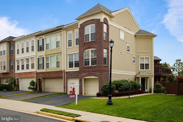 23462 Twin Falls Ter, Ashburn, VA 20148 - view of building exterior with driveway and a garage