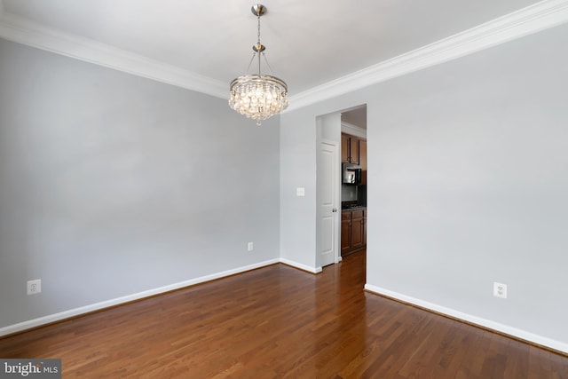 23462 Twin Falls Ter, Ashburn, VA 20148 - unfurnished room with crown molding, a chandelier, baseboards, and dark wood-type flooring