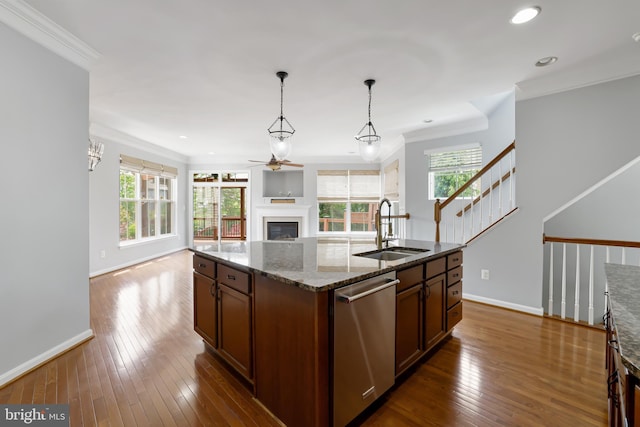23462 Twin Falls Ter, Ashburn, VA 20148 - kitchen featuring dishwasher, a sink, a ceiling fan, open floor plan, and dark stone counters