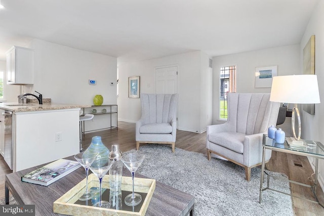 1214 Barnaby Ter SE, Washington, DC 20032 - living area with wood finished floors and baseboards