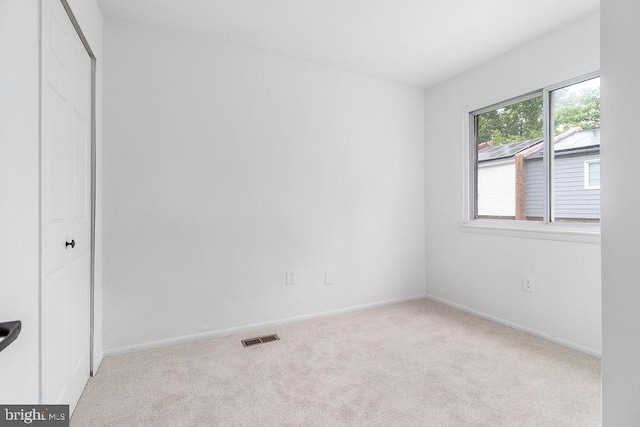 1214 Barnaby Ter SE, Washington, DC 20032 - unfurnished bedroom with carpet flooring, baseboards, and a closet