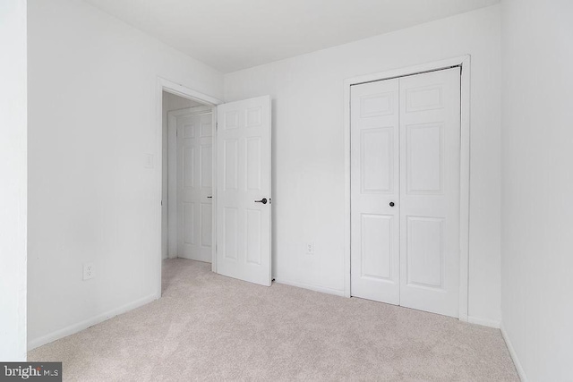 1214 Barnaby Ter SE, Washington, DC 20032 - unfurnished bedroom with carpet, a closet, and baseboards