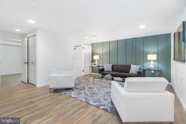 1214 Barnaby Ter SE, Washington, DC 20032 - living room with wood finished floors, baseboards, and recessed lighting