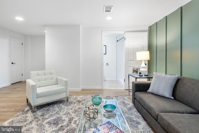 1214 Barnaby Ter SE, Washington, DC 20032 - living area featuring light wood-type flooring, baseboards, and recessed lighting