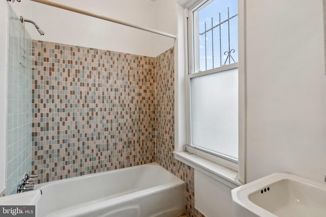 bathroom featuring washtub / shower combination