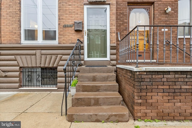 property entrance with brick siding