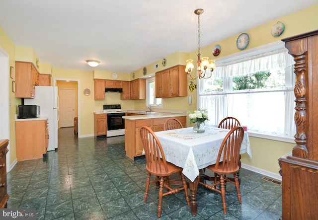2 W Cartwright Dr, Princeton Junction, NJ 08550 - dining space featuring a chandelier and baseboards