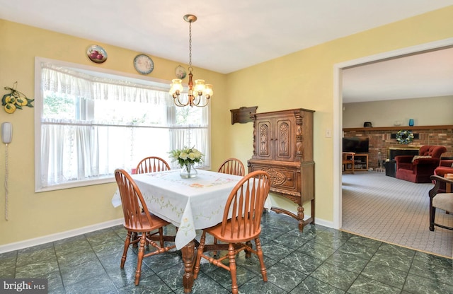 2 W Cartwright Dr, Princeton Junction, NJ 08550 - dining area featuring a chandelier, baseboards, and a fireplace