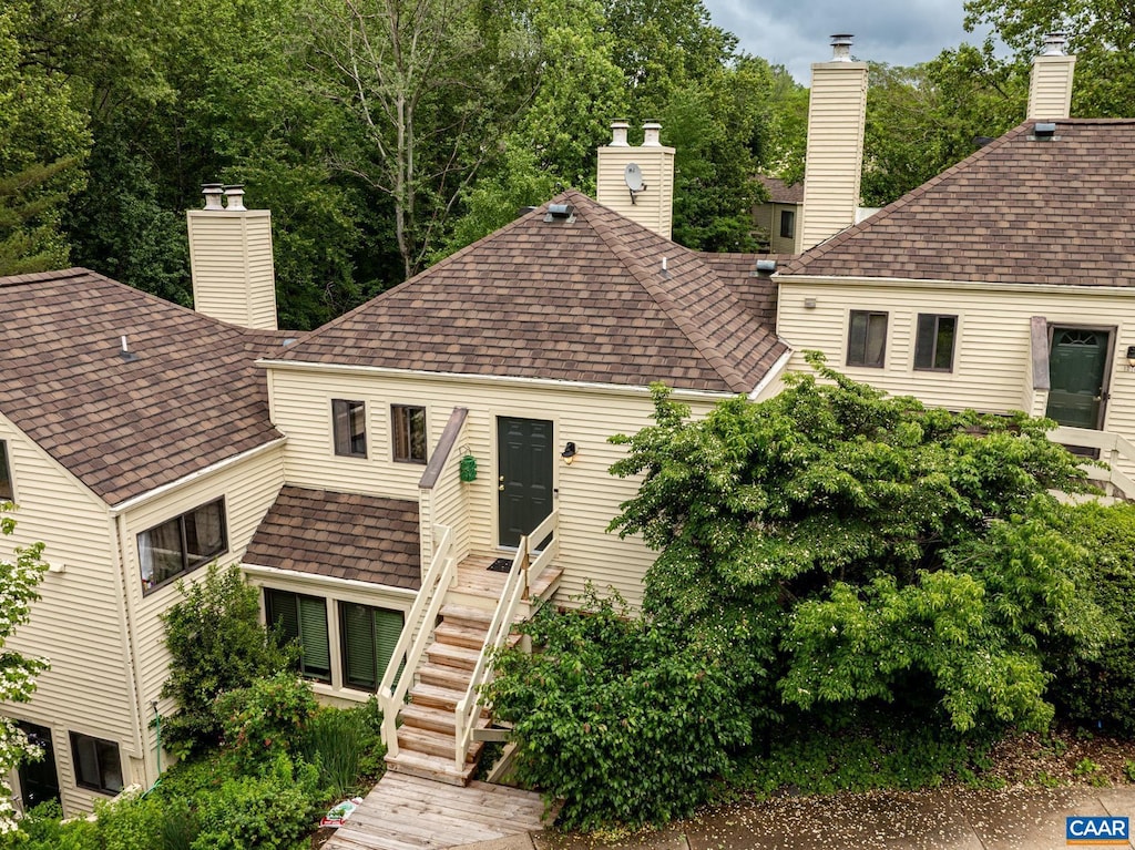 1214 Chatham Rdg, Charlottesville, VA 22901 - view of front of home featuring a chimney, a shingled roof, and stairs