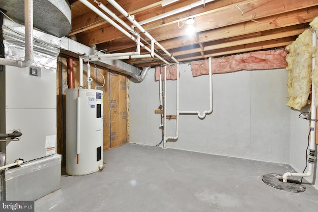 unfinished basement with electric water heater