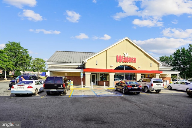 view of property featuring uncovered parking