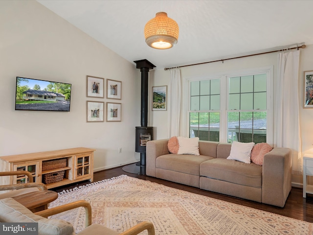 439 Windy Way, Front Royal, VA 22630 - living room featuring dark wood-style flooring, a wood stove, vaulted ceiling, and baseboards